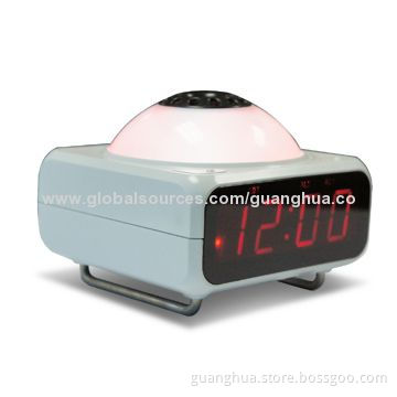 Alarm clock with perfume or mosquito repellent liquid heater function